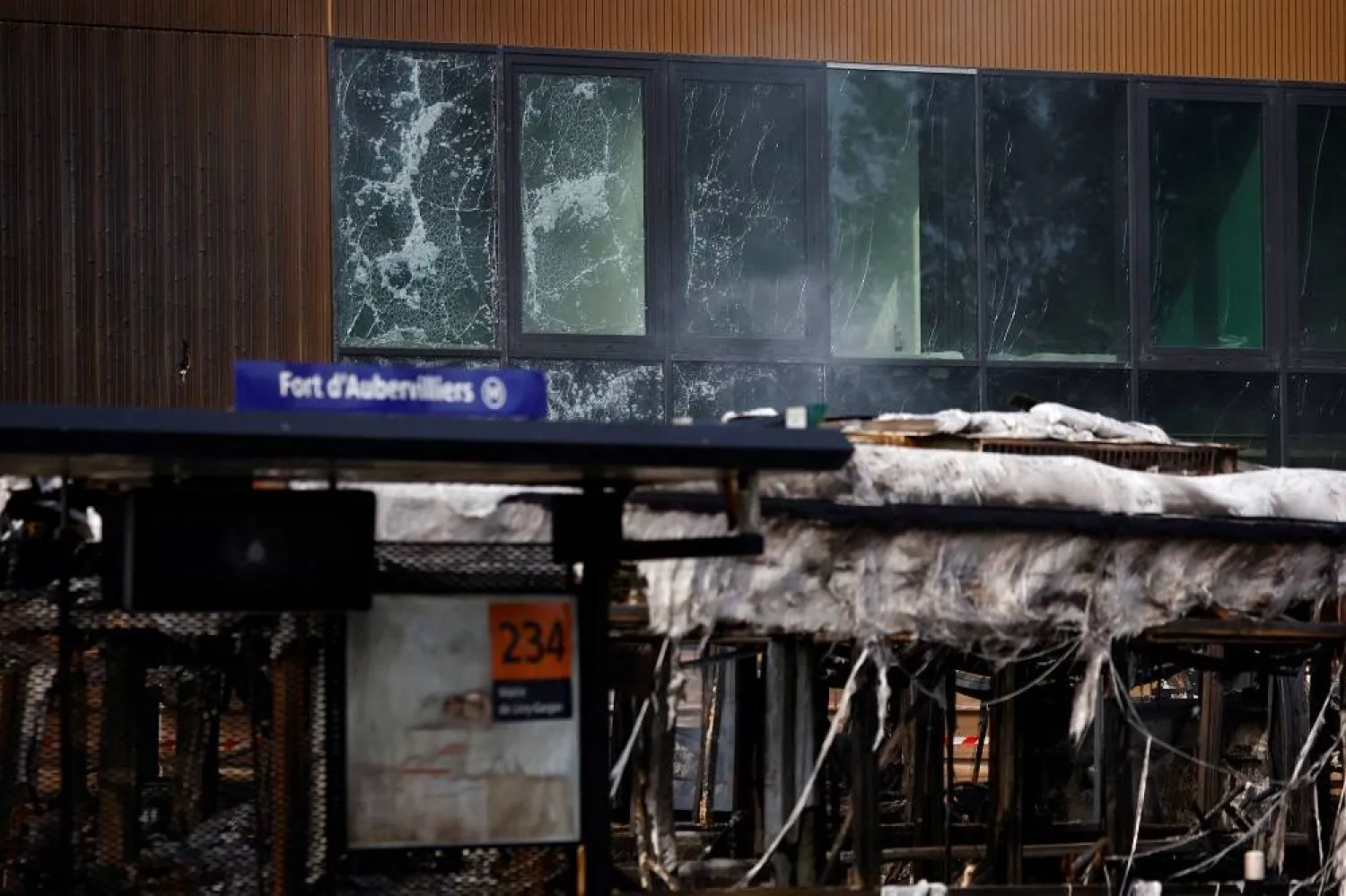 View of damaged windows of the building site of the Paris 2024 Olympics' aquatic center near a RATP bus depot damaged during night clashes between protesters and police, following the death of Nahel, a 17-year-old teenager killed by a French police officer in Nanterre during a traffic stop, in Aubervilliers, near Paris, France, June 30, 2023. (Reuters) 