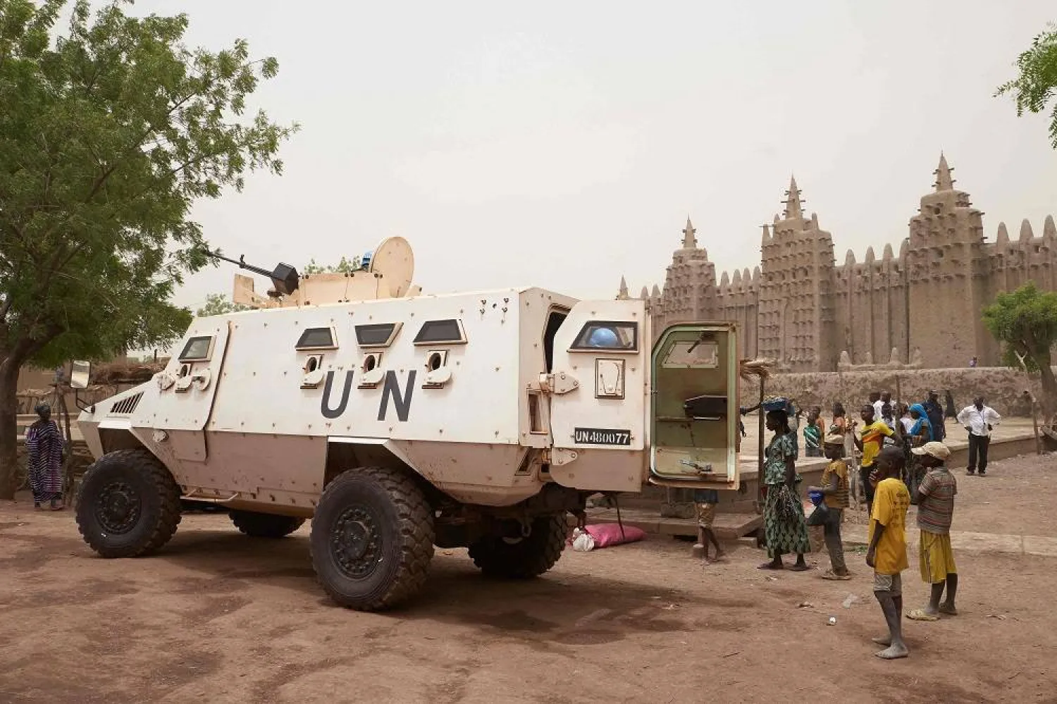 An armored vehicle of the United Nations Multidimensional Integrated Stabilisation Mission in Mali (MINUSMA) patrols during the annual rendering of the Great Mosque of Djenne in central Mali, on April 28, 2019. (AFP)