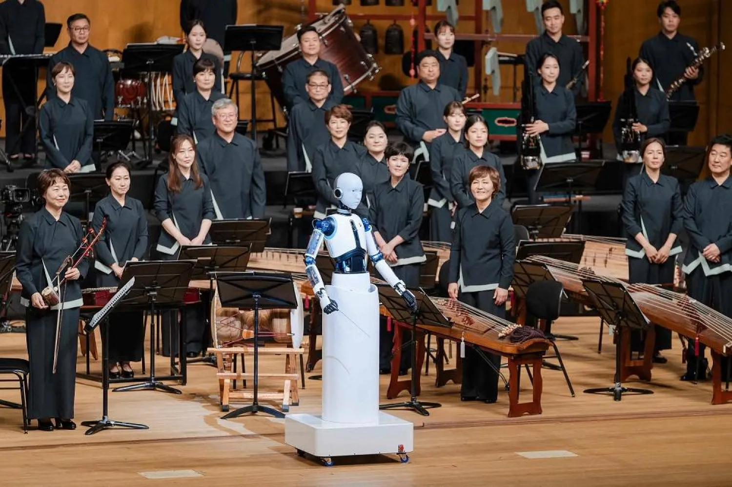 This handout picture taken on June 30, 2023 and provided by the National Theater of Korea shows the South Korean-made robot called "EveR 6" conducting musicians of the National Orchestra of Korea during a concert at the national theater in Seoul. (National Theater of Korea / AFP)  