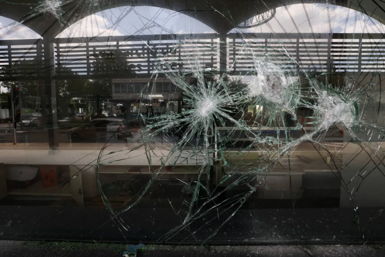 A view of the damaged glass window of the indoor market, following the death of Nahel, a 17-year-old teenager killed by a French police officer in Nanterre during a traffic stop, in L'Hay-les-Roses near Paris, France July 2, 2023. REUTERS/Yves Herman