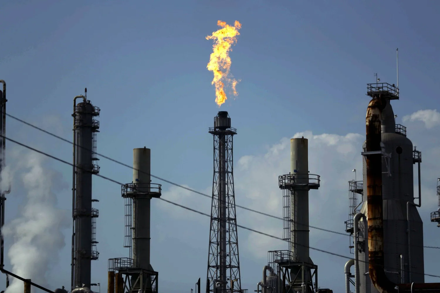 FILE - In this Thursday, Aug. 31, 2017, file photo, a flame burns at the Shell Deer Park oil refinery in Deer Park, Texas. (AP Photo/Gregory Bull, File)

