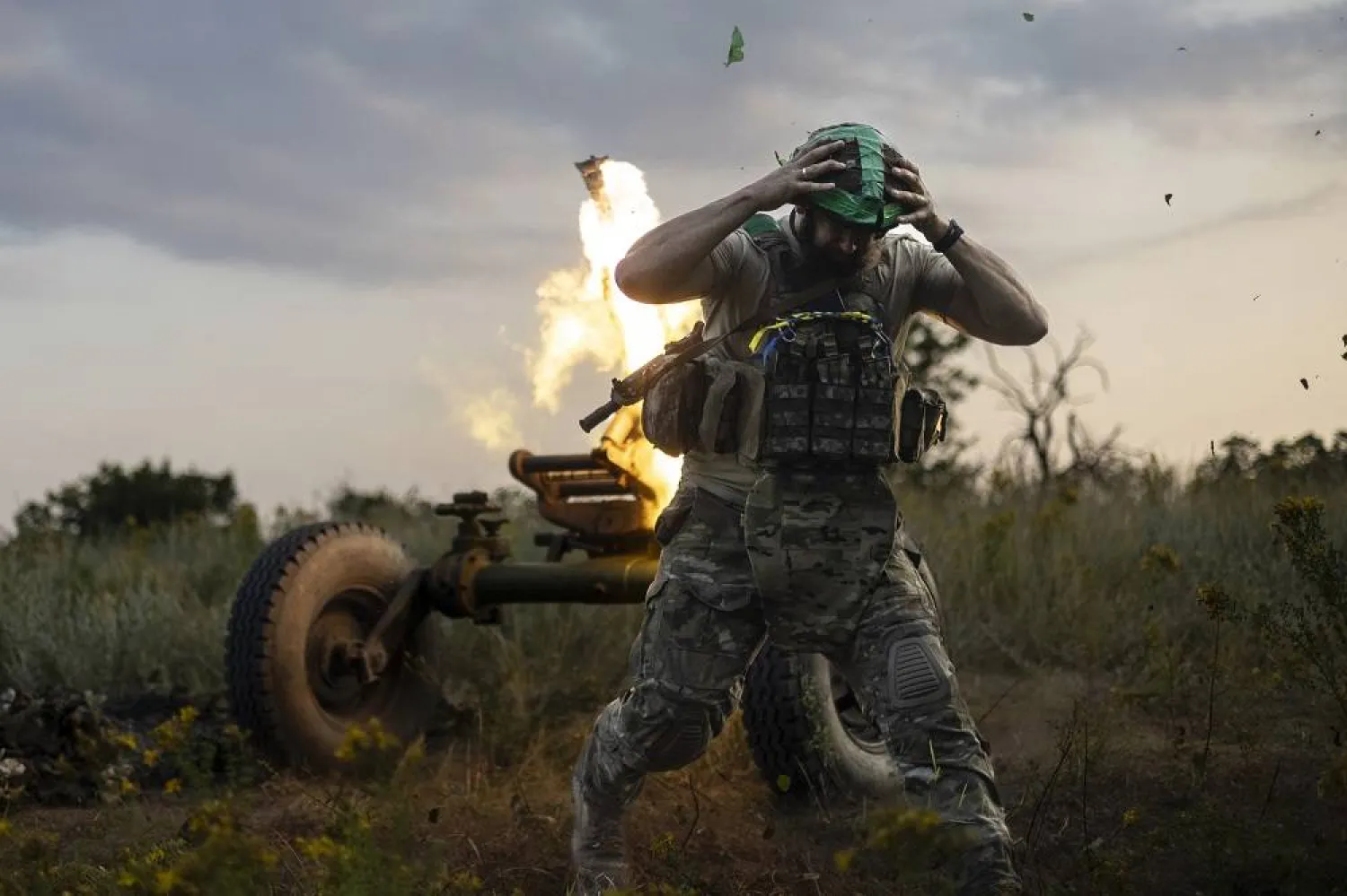 A Ukrainian serviceman of the 3rd Assault Brigade fires a 122mm mortar towards Russian positions at the front line, near Bakhmut, Donetsk region, Ukraine, Sunday, July 2, 2023. (AP) 