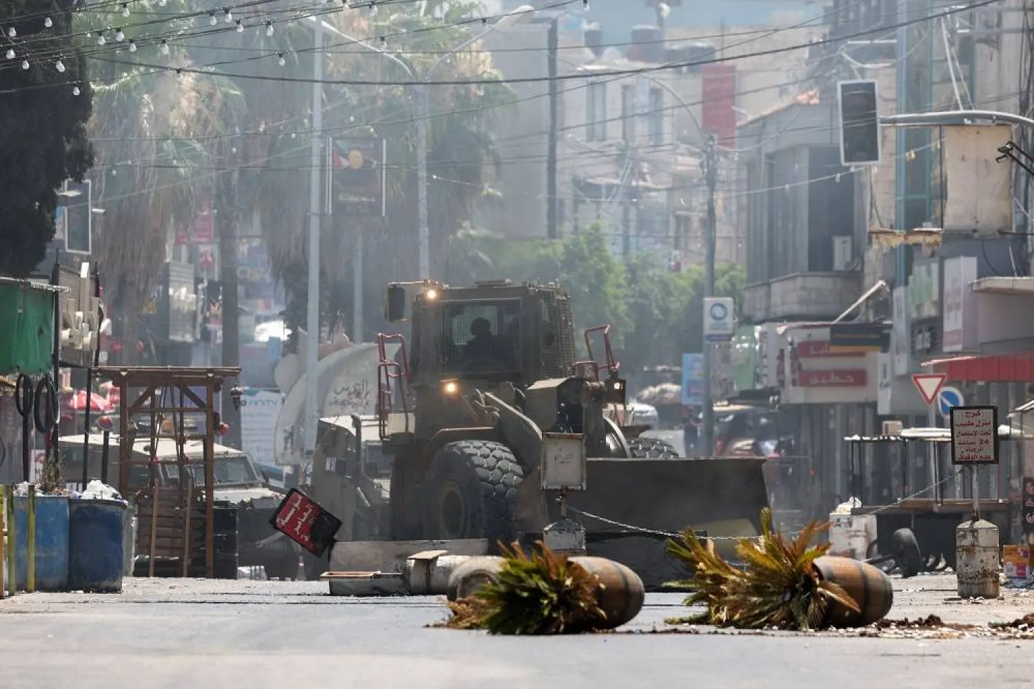 An Israeli army bulldozer drives through Jenin in the occupied West Bank during a military operation on July 3, 2023. (AFP)
