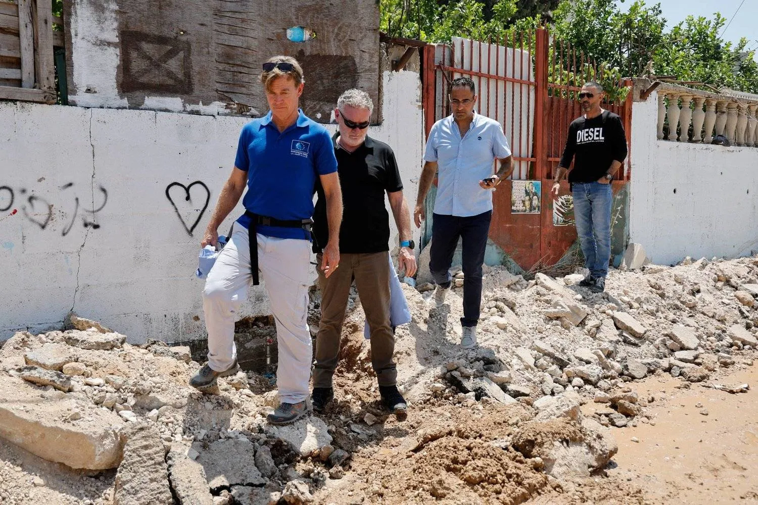 EU representative to the Palestinian territories Sven Kuehn von Burgsdorff inspects damaged buildings in Jenin on Saturday (Reuters)
