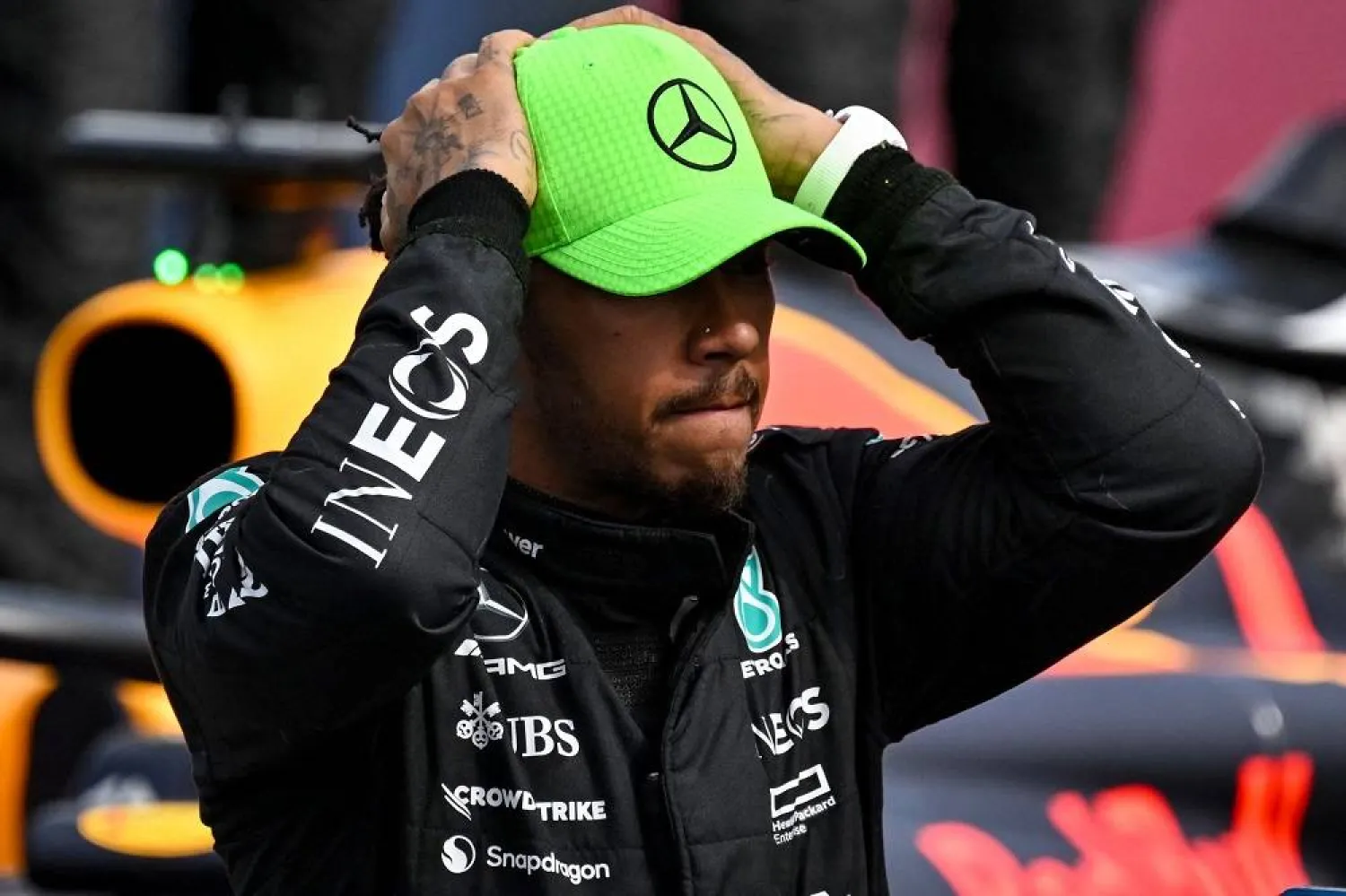 Mercedes' British driver Lewis Hamilton reacts after coming third in the Formula One British Grand Prix at the Silverstone motor racing circuit in Silverstone, central England on July 9, 2023. (AFP0