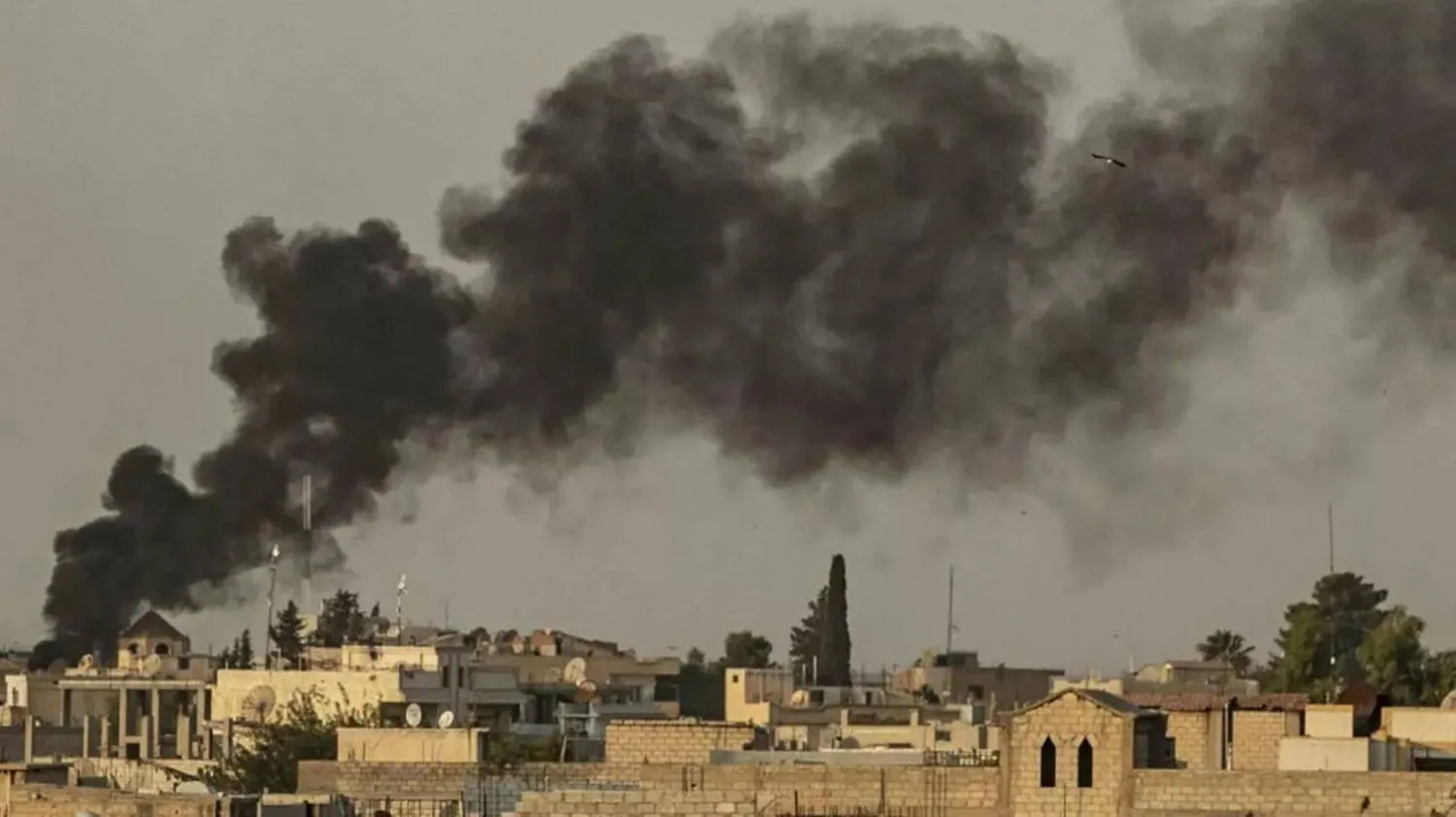 Smoke billows after a Turkish bombardment on Syria's northeastern town of Ras al-Ain along the Turkish border on October 9, 2019. (AFP)

