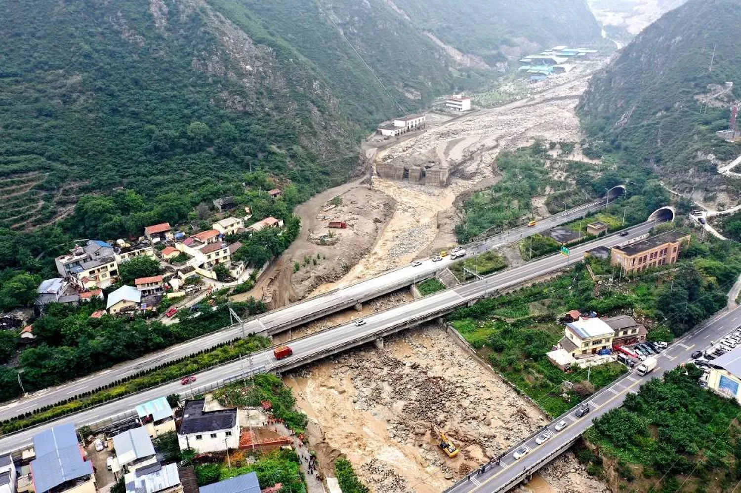 This aerial photo taken on June 27, 2023 shows a view of a landslide site in Miansi Township of Wenchuan County, southwest China's Sichuan Province. (EPA/XINHUA / Wang Xi)