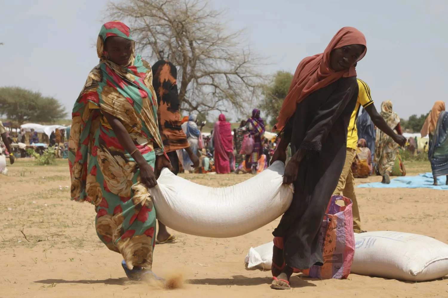 Sudanese refugees who fled the conflict in Sudan gather July 1, 2023 at the Zabout refugee Camp in Goz Beida, Chad. (Marie-Helena Laurent/WFP via AP)