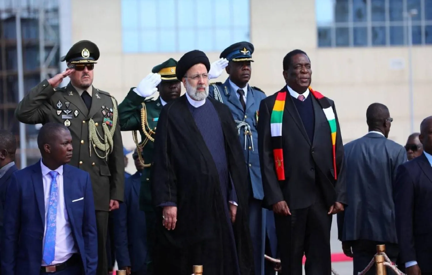 Iranian President Ebrahim Raisi is welcomed by Zimbabwean President Emmerson Mnangagwa, at Harare airport in Harare, Zimbabwe, on July 13, 2023. Iran's Presidency/Mohammad Javad Ostad/WANA (West Asia News Agency)/Handout via REUTERS