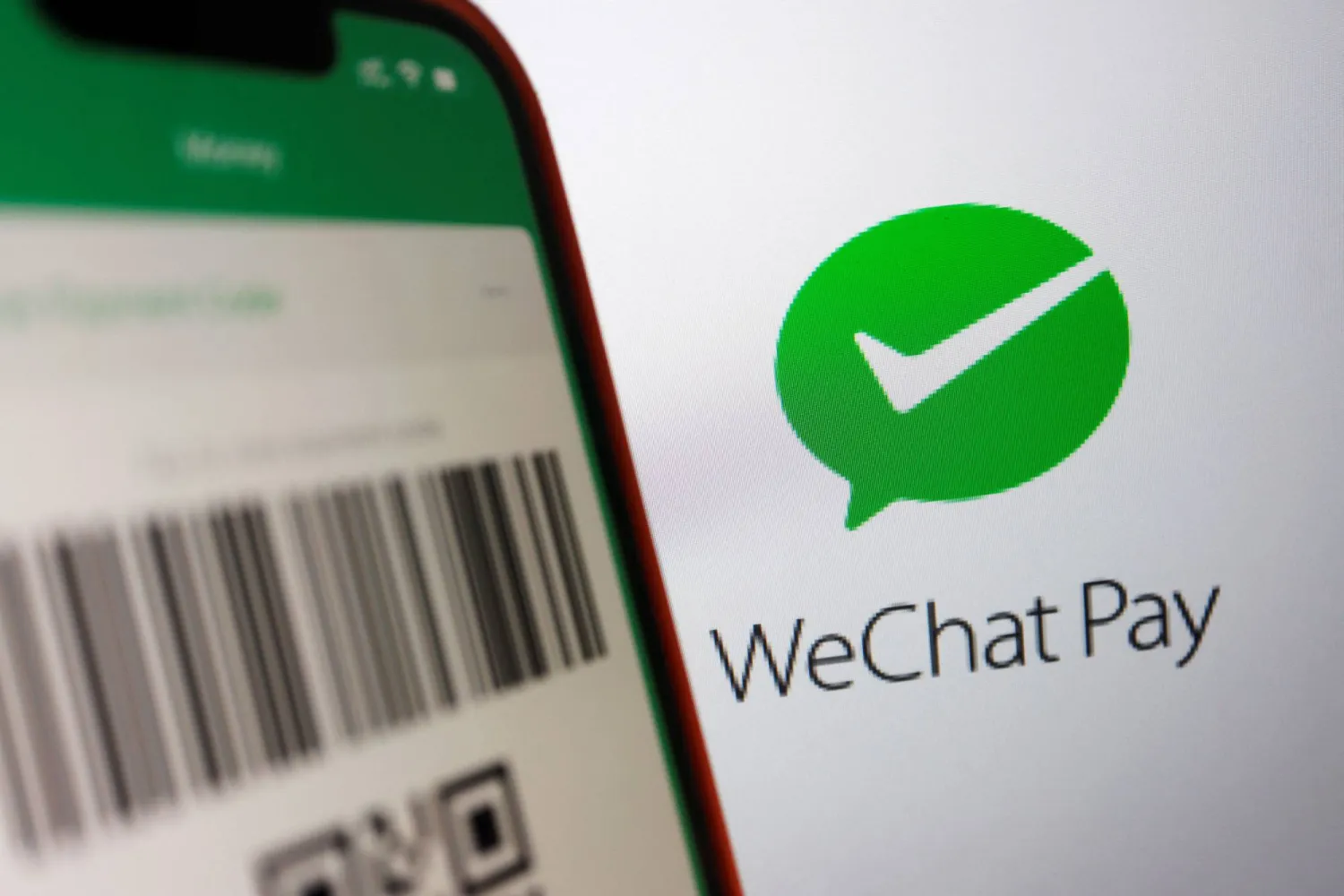 The Wechat Pay logo is displayed next to a QR payment code on the Wechat app, in this illustration picture taken June 28, 2023. Reuters