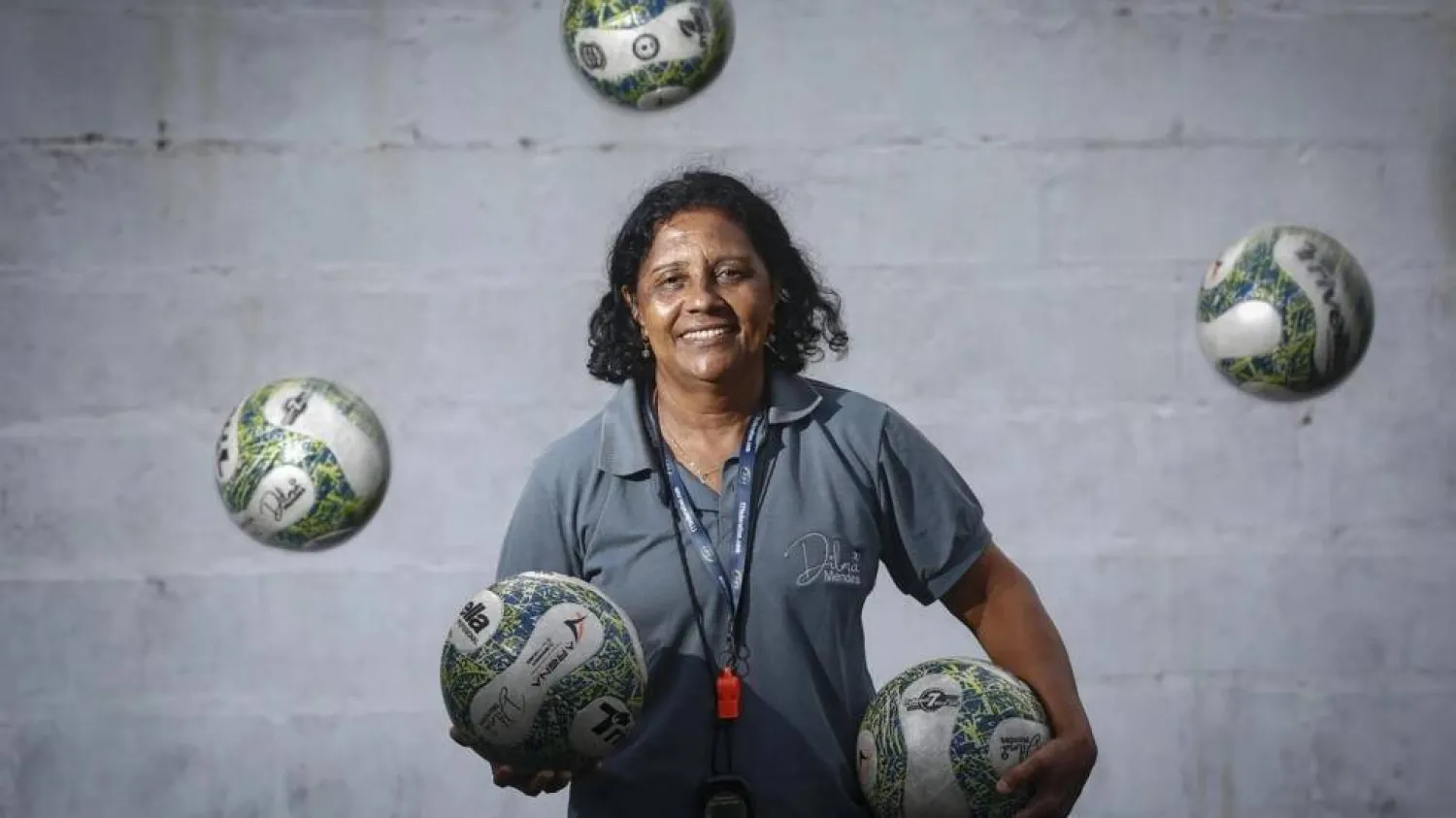 Women's football coach Dilma Mendes, 59, poses for a picture at the Arena 2 de Julho Football School located in the city of Camacari, Bahia state, Brazil. RAFAEL MARTINS / AFP