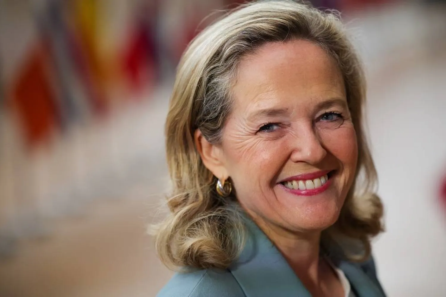 Spain's Finance Minister Nadia Calvino smiles as she arrives to speaks with members of the media ahead of a meeting of European finance ministers at EU Economic and Financial Affairs Council in Brussels, Belgium, 14 July 2023. (EPA) 
