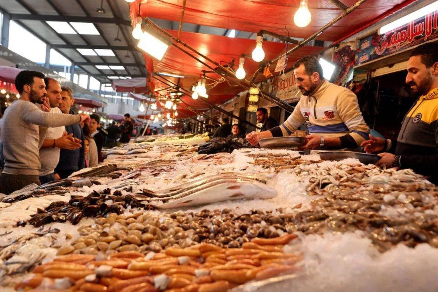 Fish and seafood vendor in one of the markets in the city of Port Said (northeast Egypt) as inflation reaches an unprecedented peak in the country (Reuters)
