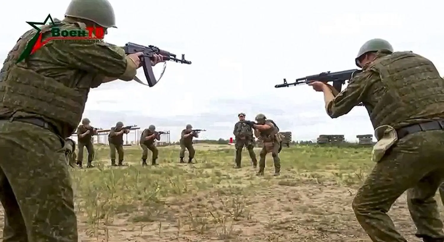 In this photo taken from video released by Belarusian Defense Ministry via VoenTV on Friday, July 14, 2023, Belarusian soldiers attend a training by mercenary fighters from Wagner private military company near Tsel village, about 90 kilometers (about 55 miles) southeast of Minsk, Belarus. (Belarusian Defense Ministry via VoenTV via AP) 