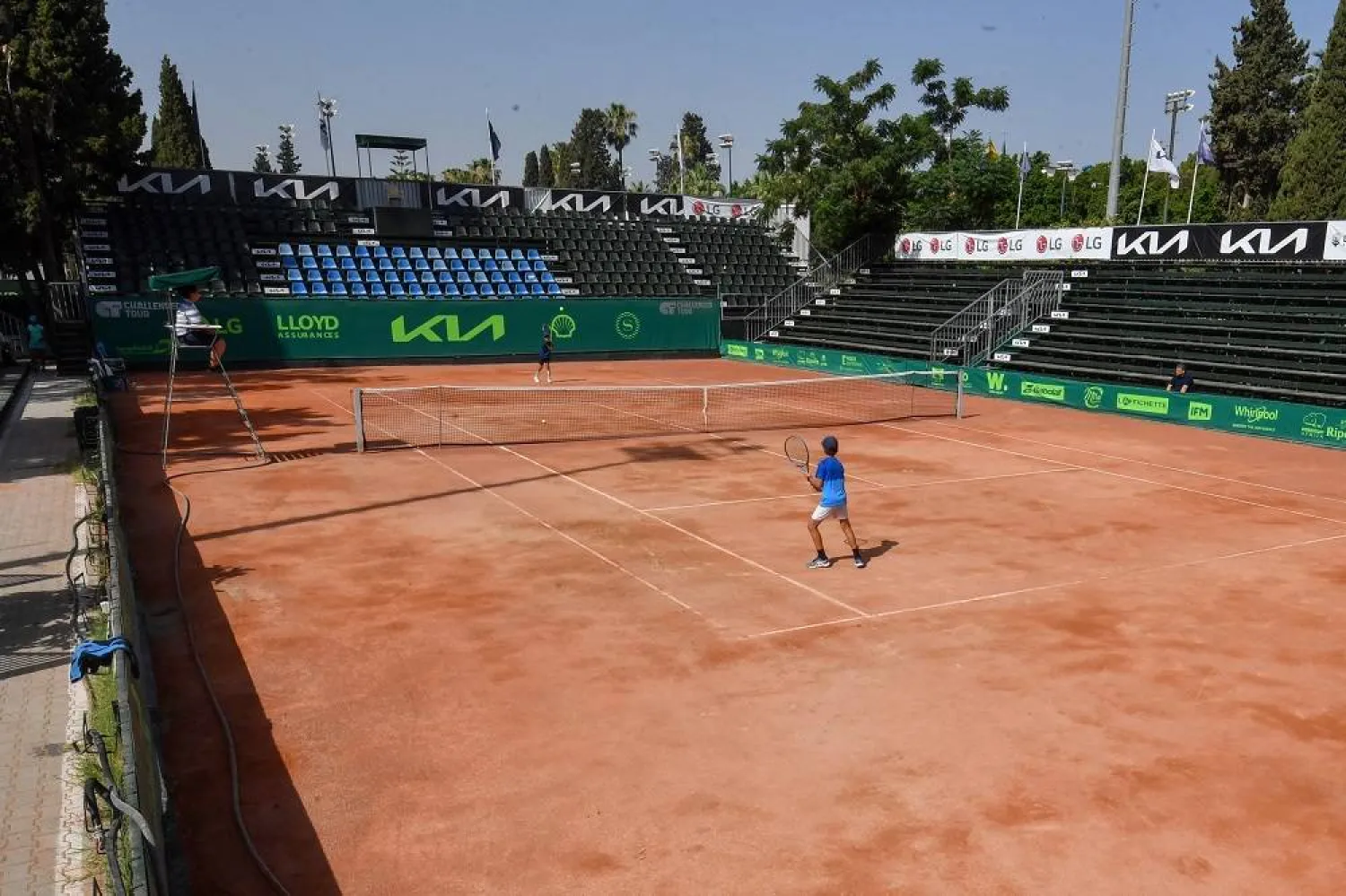 Tunisian children compete during a local tournament at the Tennis Club of Tunis on July 15, 2023, on the day of Tunisian player Ons Jabeur's Wimbledon final. (AFP) 
