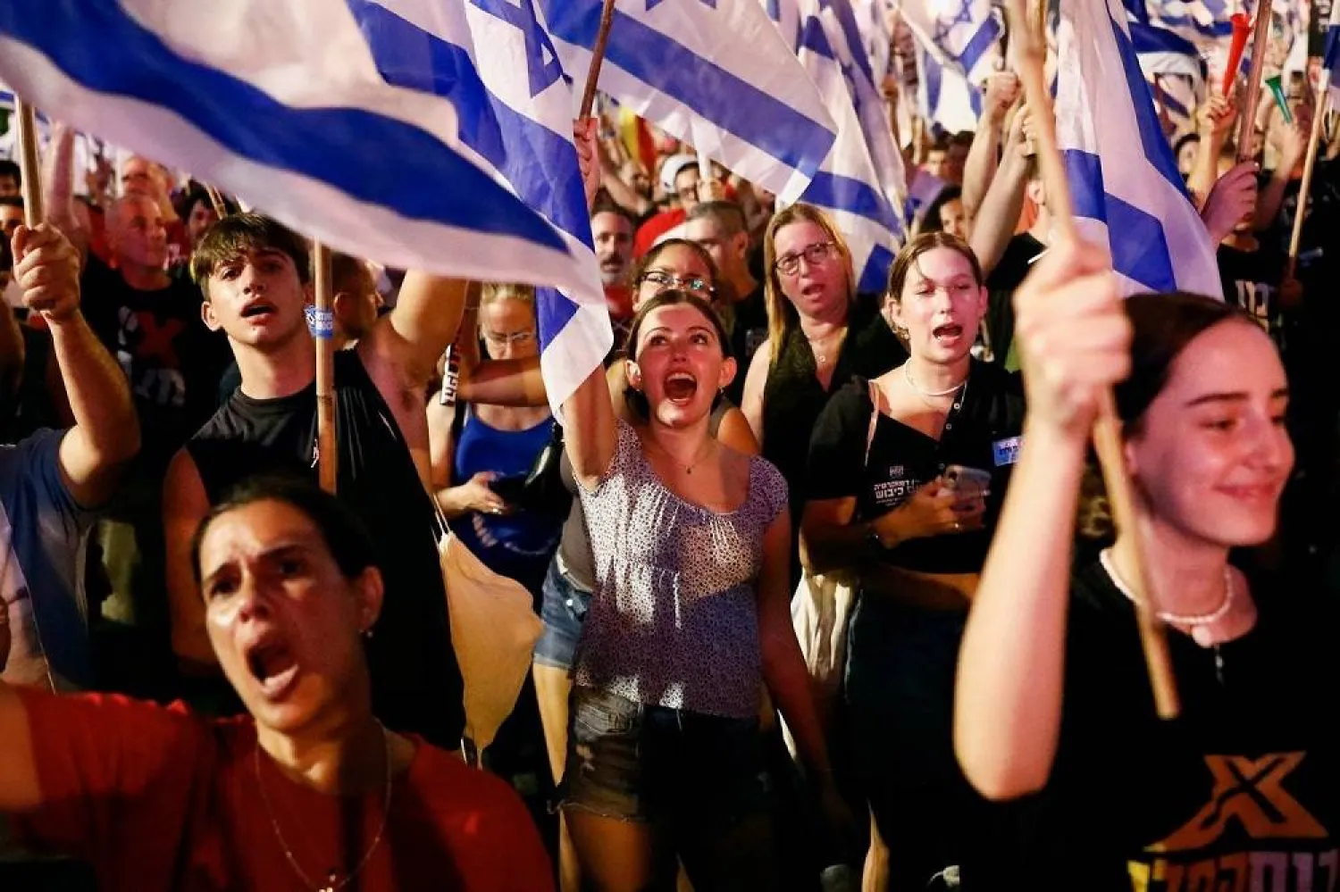 Young Israelis demonstrate against Prime Minister Benjamin Netanyahu in Tel Aviv on Friday. (Reuters)