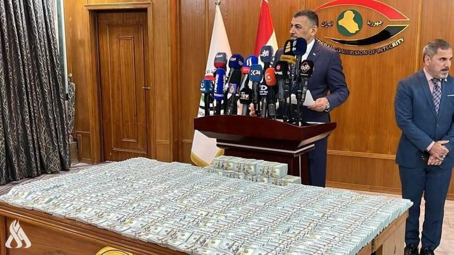 القاضي حيدر حنون خلال مؤتمر استعادة الأموال والعقارات (وكالة الأنباء العراقية)