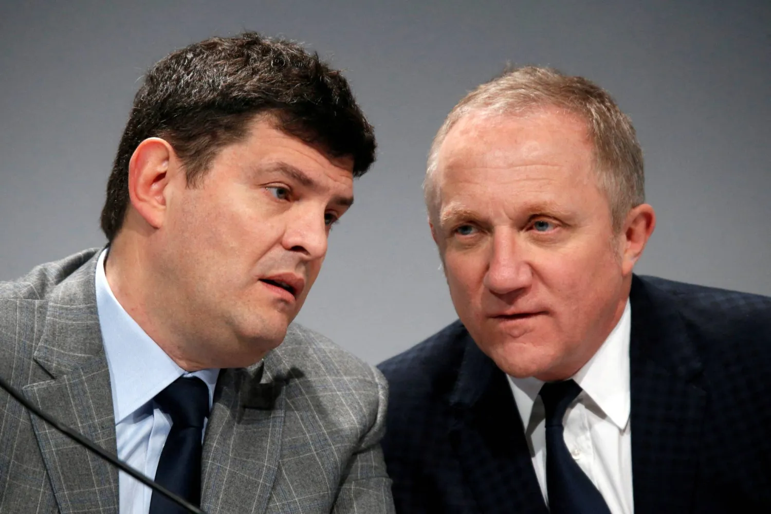 FILE PHOTO: Francois-Henri Pinault (R), CEO and Chairman of the board of directors of Kering, talks with group managing director Jean-Francois Palus (L) during the company's 2015 annual results presentation in Paris, France, February 19, 2016. REUTERS/Charles Platiau/File Photo