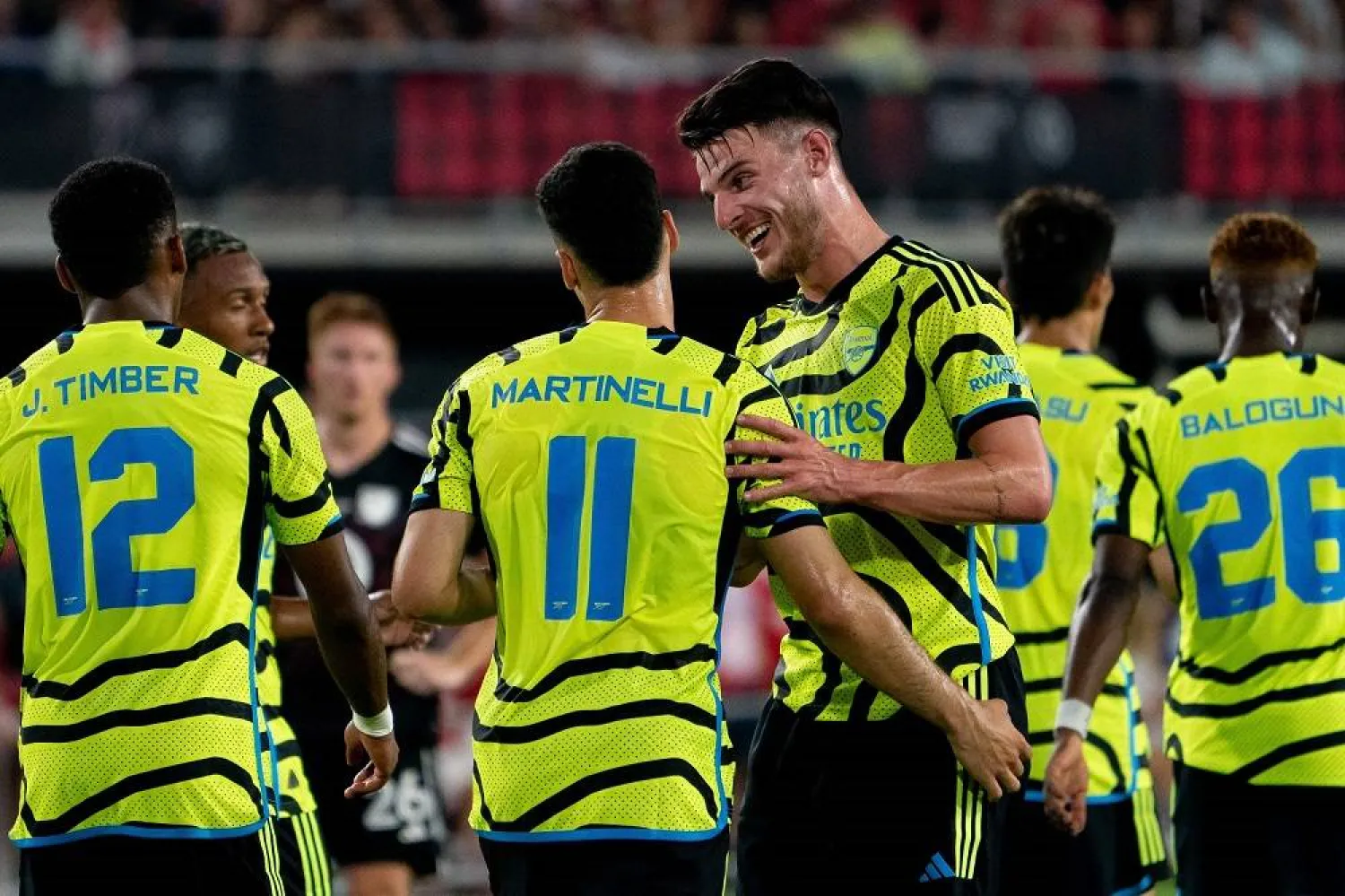 Arsenal's Declan Rice celebrates with teammate Gabriel Martinelli after Martinelli scored a goal during a friendly football match between the Major League Soccer (MLS) All-Star team and Arsenal FC, at Audi Field in Washington, DC, on July 19, 2023. (AFP)