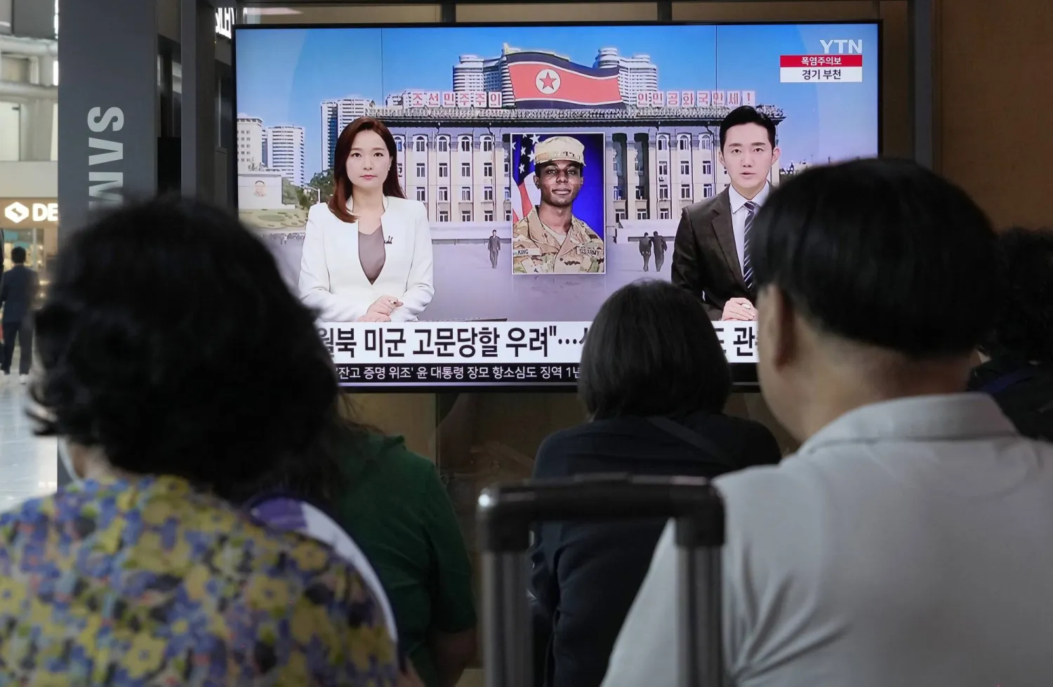 A TV screen shows a file image of American soldier Travis King during a news program at the Seoul Railway Station in Seoul, South Korea, Saturday, July 22, 2023.(AP Photo/Ahn Young-joon)