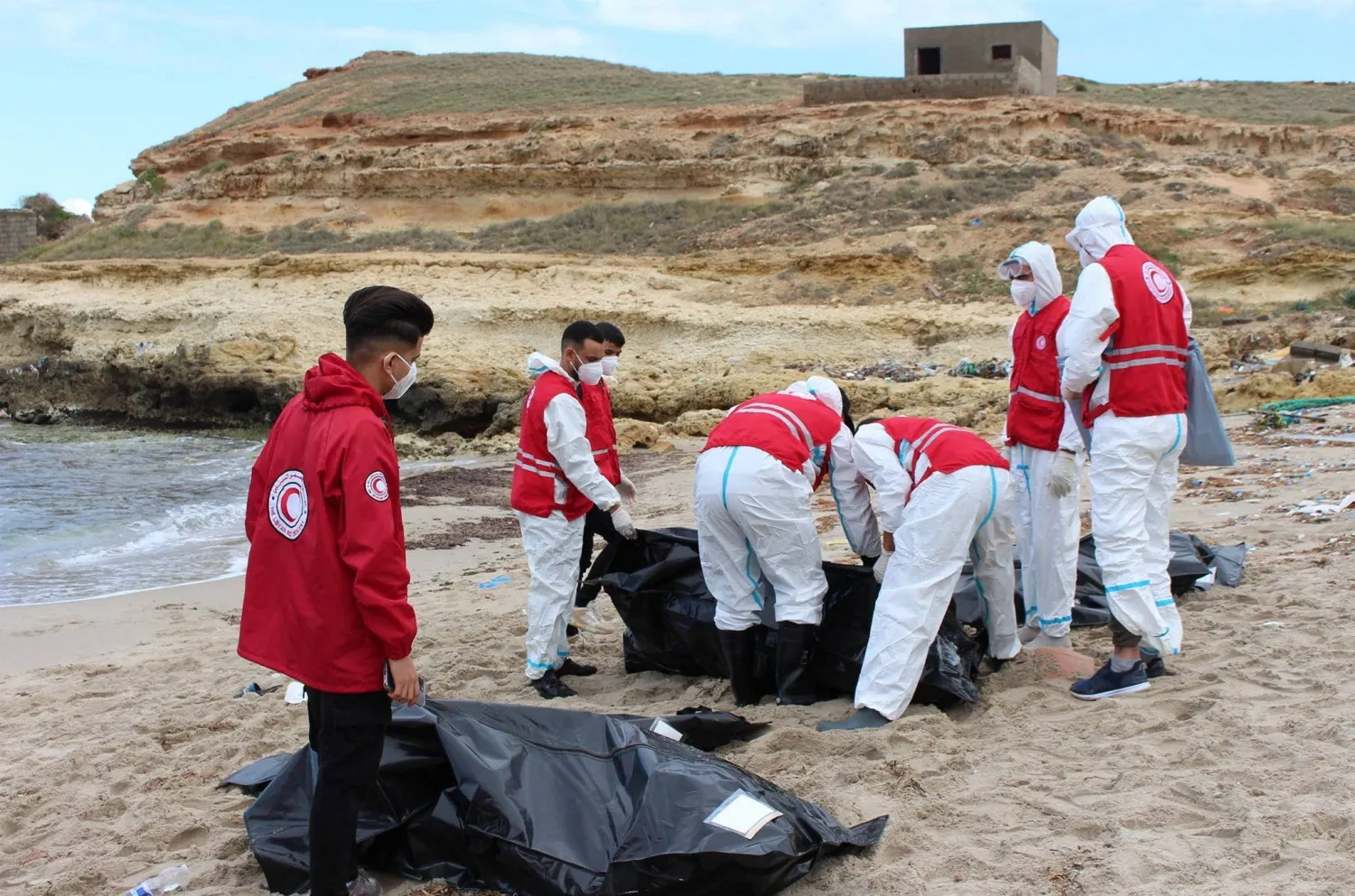 The bodies of migrants who drowned at see are retrieved in Libya. (Reuters)