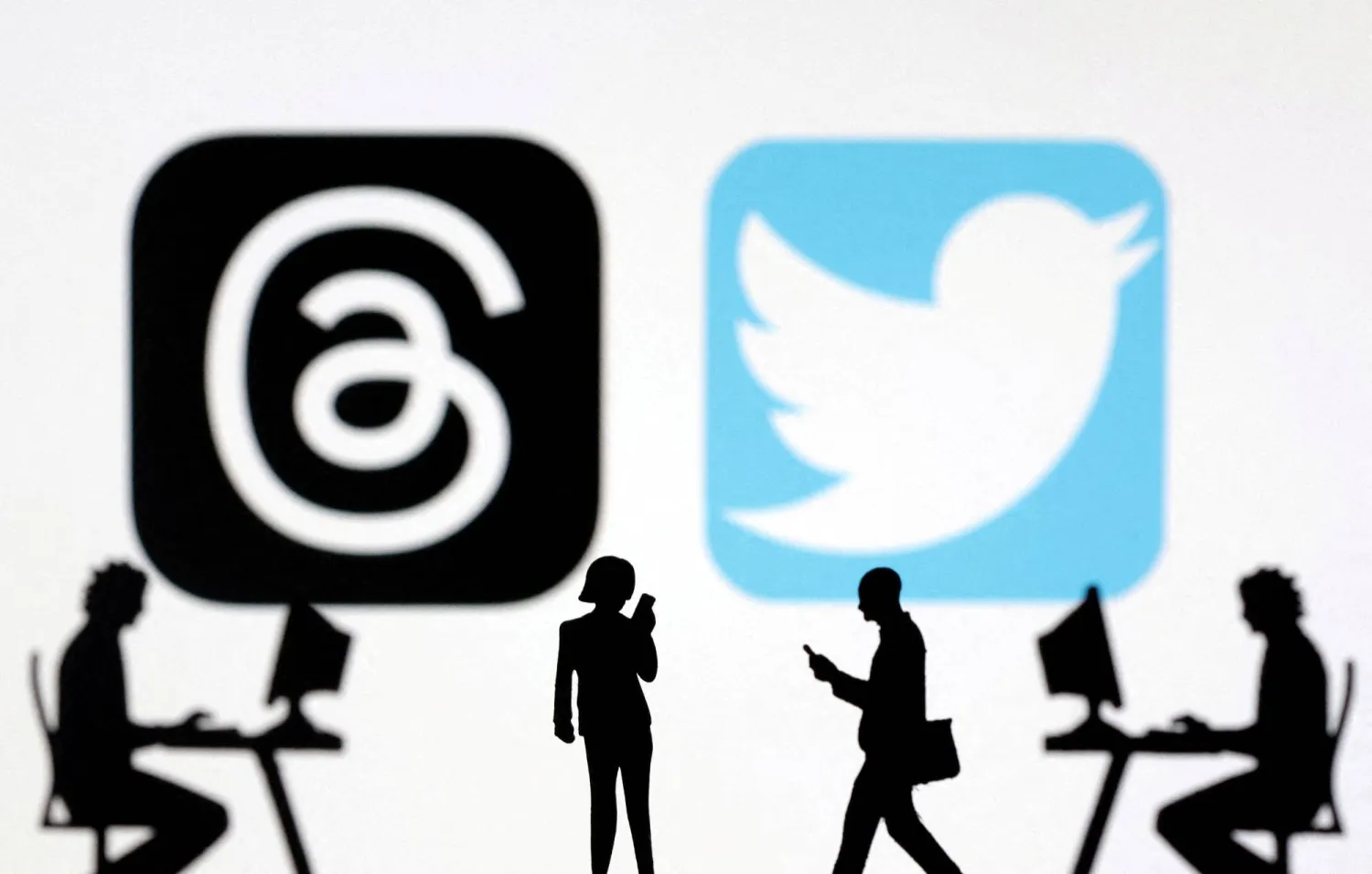 FILE PHOTO: Meta Threads and Twitter app logos are seen in this illustration taken, July 6, 2023. REUTERS/Dado Ruvic/Illustration/File Photo