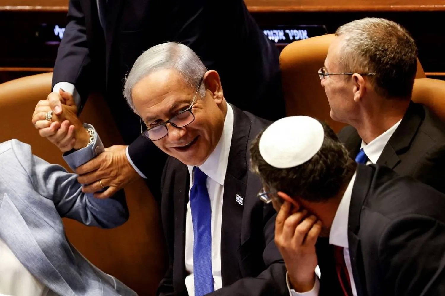 Israeli Prime Minister Benjamin Netanyahu and lawmakers gather at the Knesset plenum to vote on a bill that would limit some Supreme Court power, in Jerusalem July 24, 2023. (Reuters) 