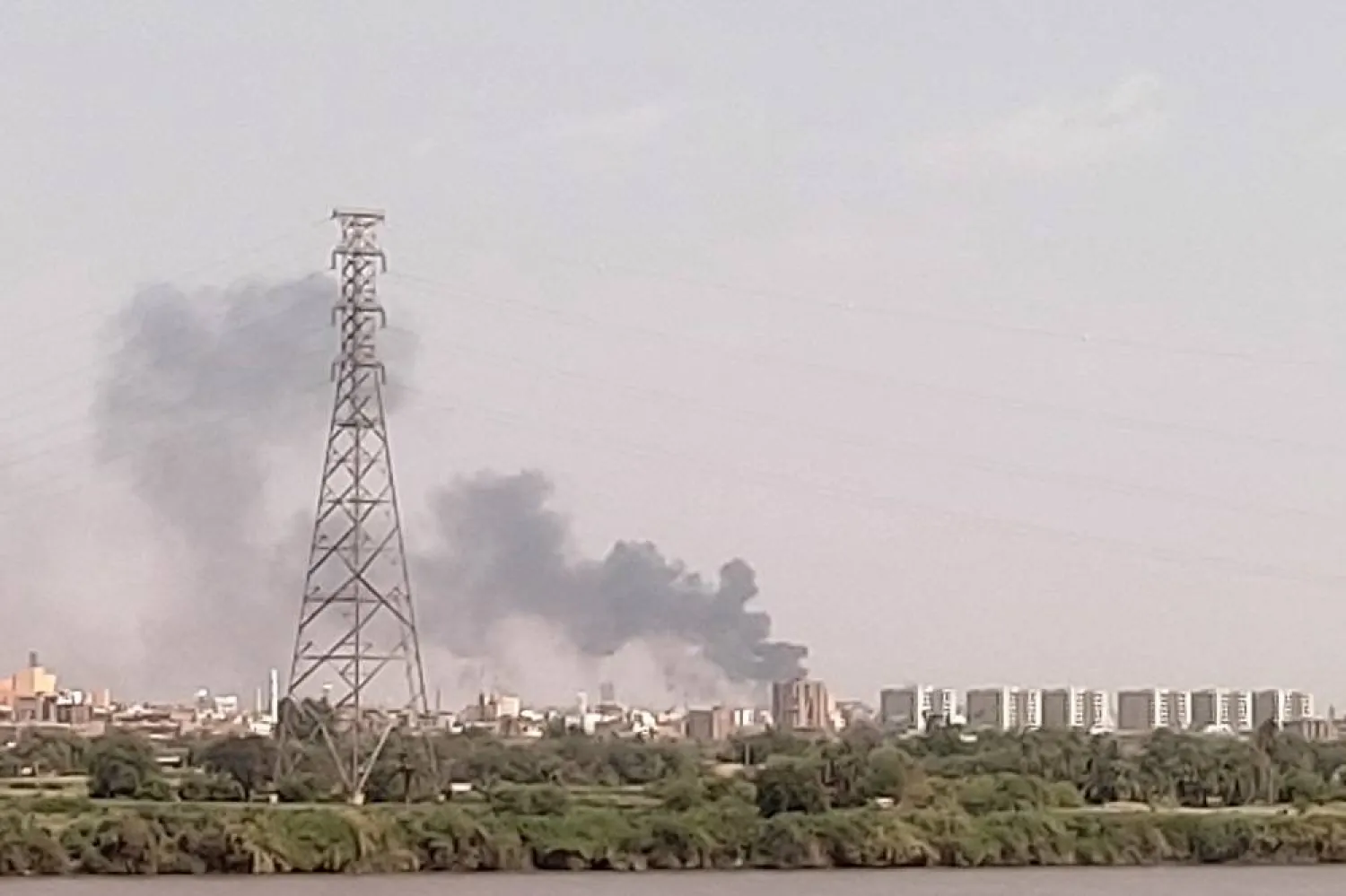 A picture taken from Omdurman shows smoke billowing north of Khartoum on July 22, 2023. (AFP)