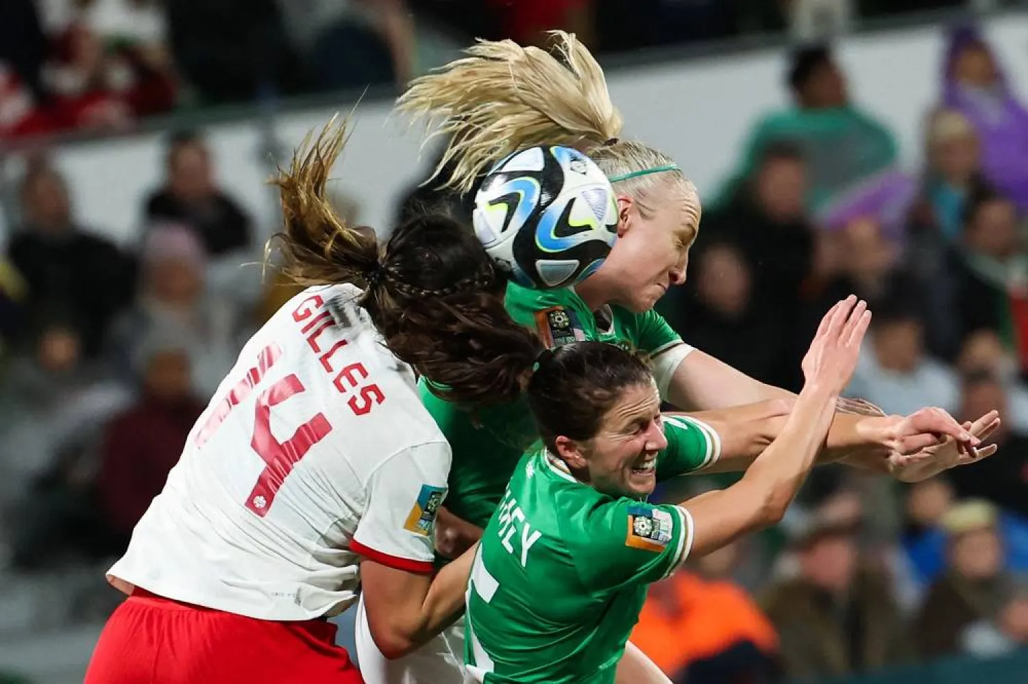 Ireland's defender #05 Niamh Fahey (R), Ireland's defender #04 Louise Quinn (C), and Canada's defender #14 Vanessa Gilles contest a header during the Australia and New Zealand 2023 Women's World Cup Group B football match between Canada and Ireland at Perth Rectangular Stadium in Perth on July 26, 2023. (AFP)