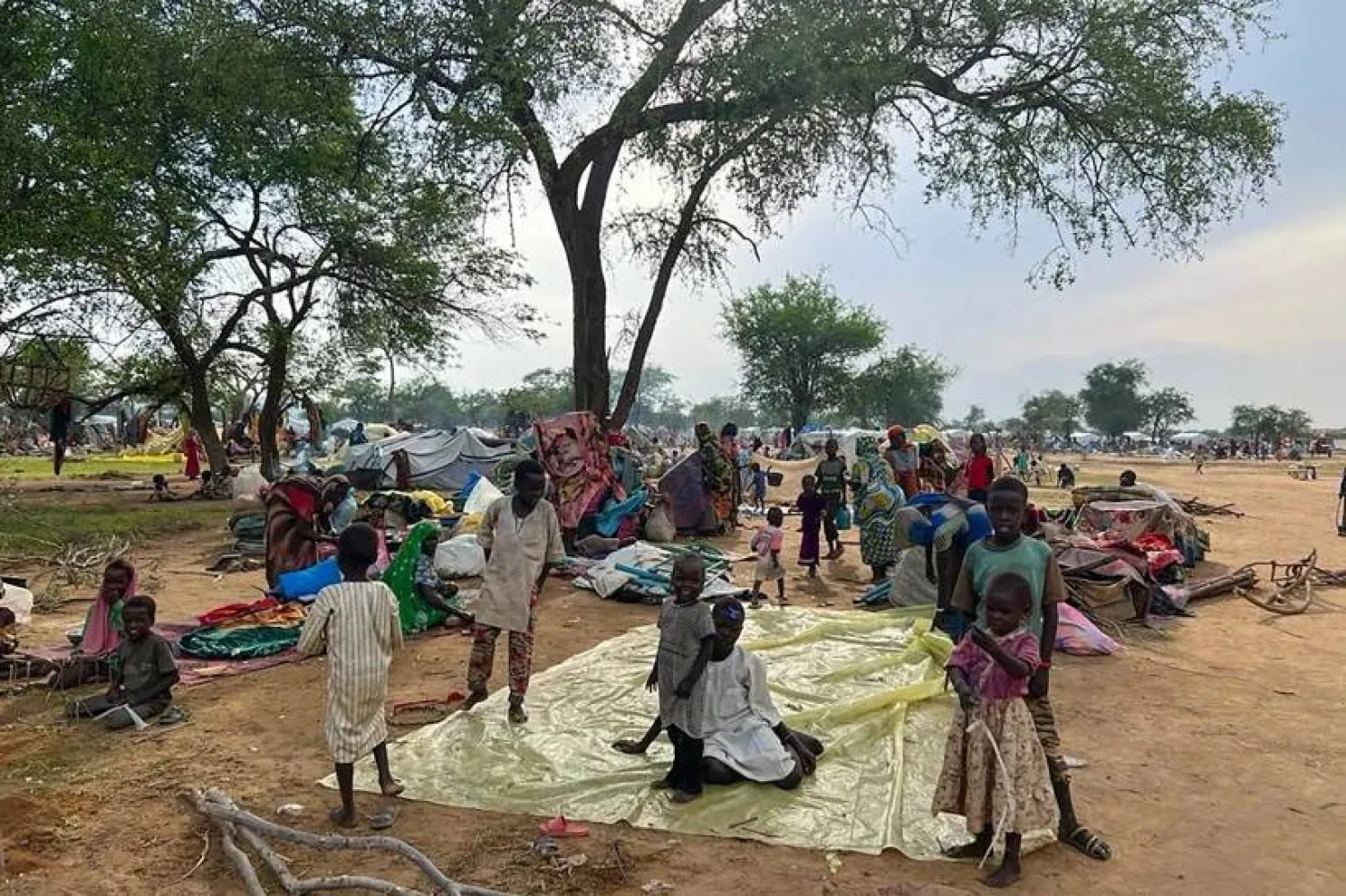 File - Sudanese refugees who fled the conflict in Sudan gather Monday, July 10, 2023, at the Zabout refugee Camp in Goz Beida, Chad. (Pierre Honnorat/WFP via AP, File)

