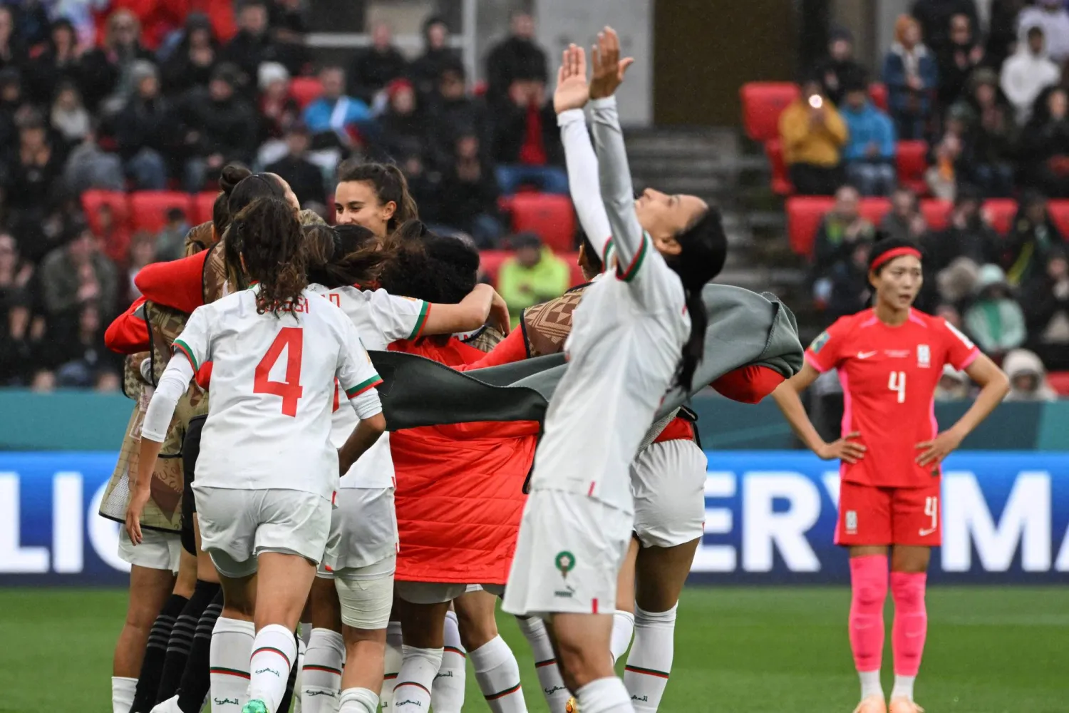 Morocco players celebrate their victory after the end of the Australia and New Zealand 2023 Women's World Cup Group H football match between South Korea and Morocco at Hindmarsh Stadium in Adelaide on July 30, 2023. (Photo by Brenton EDWARDS / AFP)