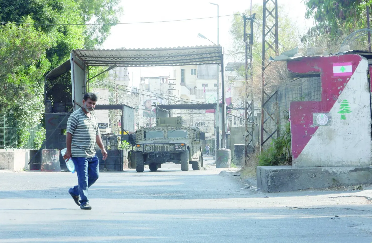 An army military vehicle is parked at the entrance of Ain al-Hilweh Palestinian refugee camp during Palestinian faction clashes, in Sidon, Lebanon July 30, 2023. REUTERS/Aziz Taher