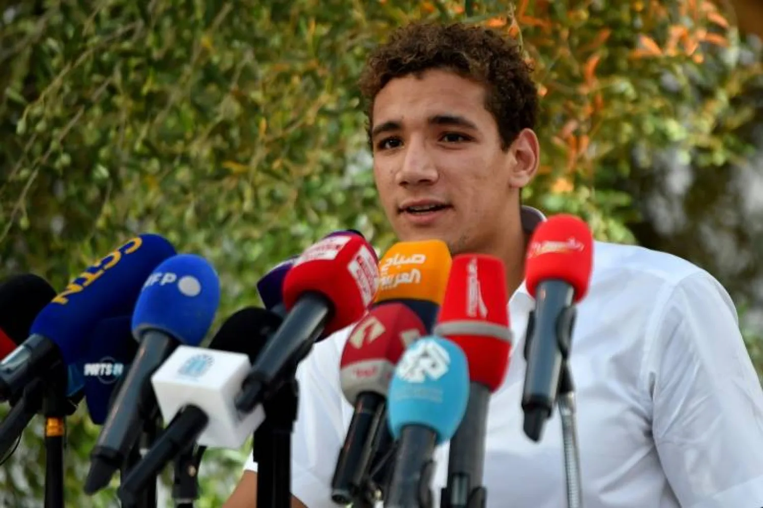 Homecoming: Ahmed Hafnaoui gives a press conference in Tunis - AFP
