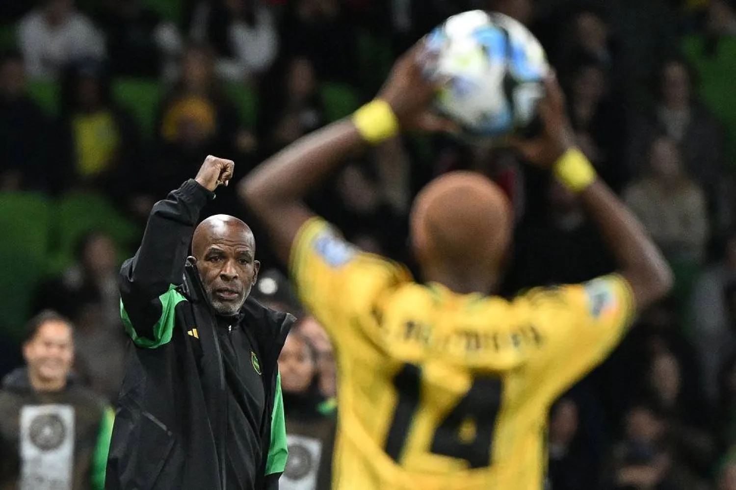Jamaica's coach Lorne Donaldson gestures as Jamaica's defender #14 Deneisha Blackwood makes a throw-in during the Australia and New Zealand 2023 Women's World Cup Group F football match between Jamaica and Brazil at Melbourne Rectangular Stadium, also known as AAMI Park, in Melbourne on August 2, 2023. (AFP)