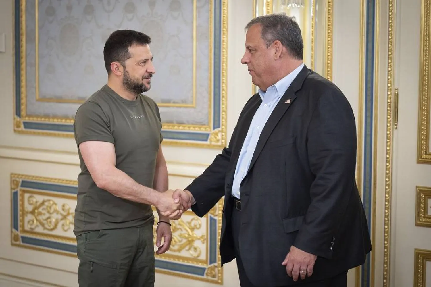 In this photo provided by the Ukrainian Presidential Press Office, Ukrainian President Volodymyr Zelenskiy, left, and Republican presidential candidate former New Jersey Gov. Chris Christie shake hands during their meeting in Kyiv, Ukraine, Friday, Aug. 4, 2023. (Ukrainian Presidential Press Office via AP) 