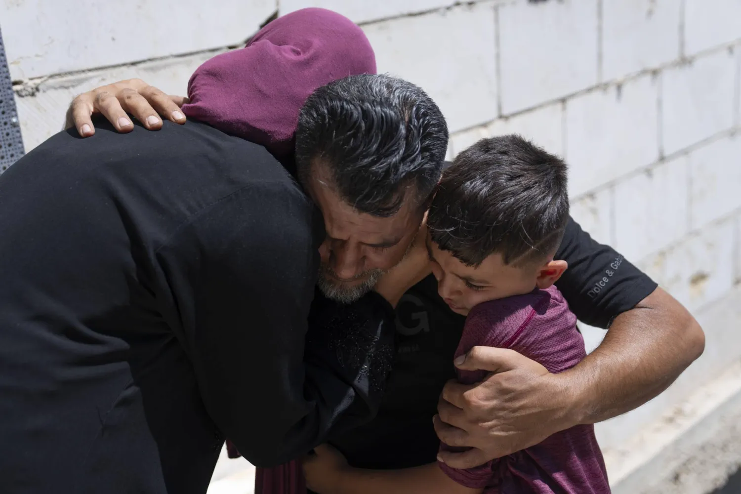 Mourners cry after taking the last look at the body of Qusai Matan, 19, during his funeral in the West Bank village of Burqa, east of Ramallah, Saturday, Aug. 5, 2023. (AP Photo/Nasser Nasser)