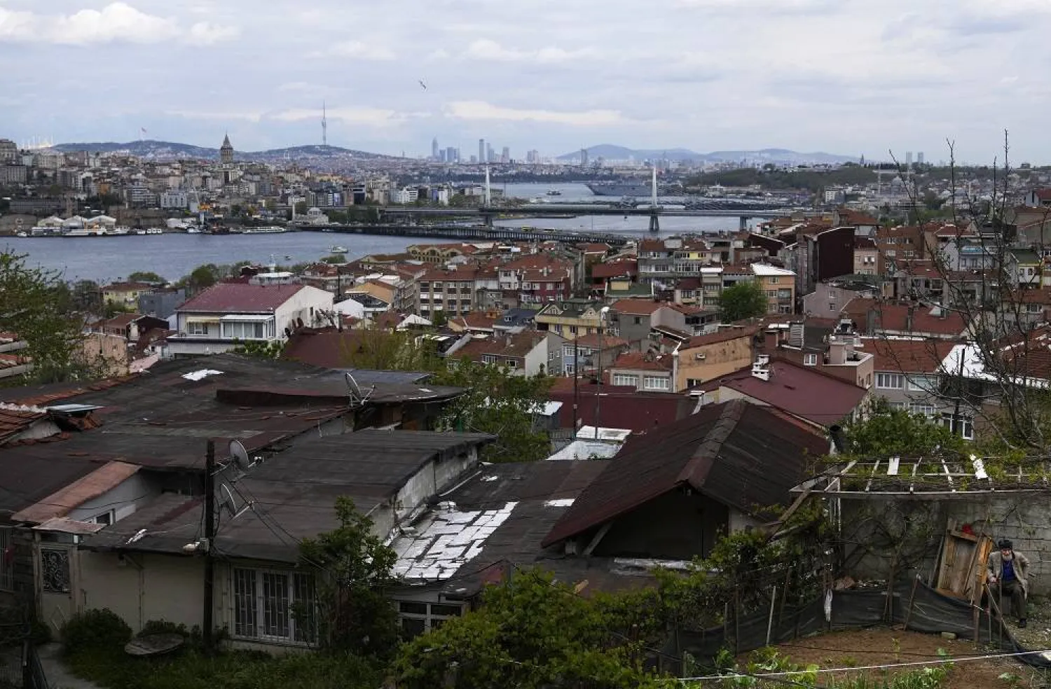 An elderly man sits in the backyard of a house in the Fatih old district of Istanbul, Türkiye, Tuesday, April 29, 2023. (AP)