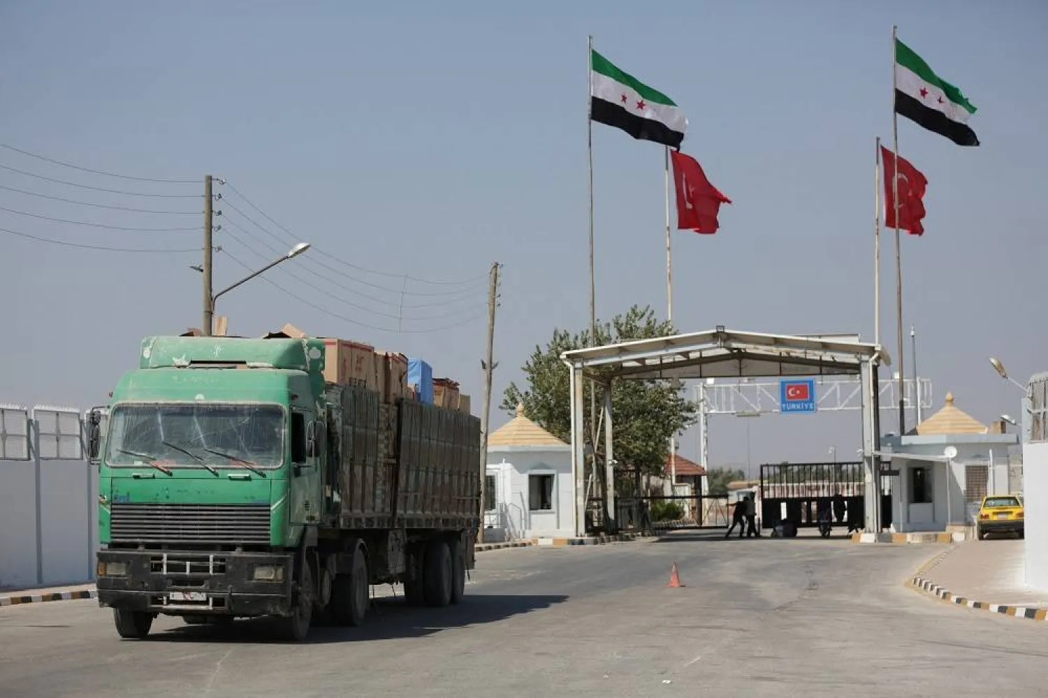 A Syrian truck carrying Turkish goods enters from Bab al Salam point near the city of Azaz, Syria August 20, 2018. (Reuters)