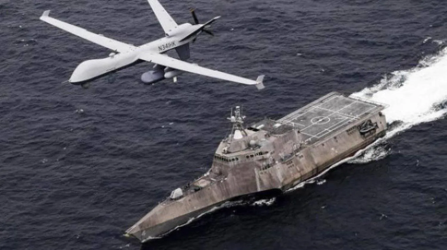 In this handout image from the US Navy, an MQ-9 Sea Guardian unmanned maritime surveillance drone flies over the USS Coronado in the Pacific Ocean during a drill April 21, 2021. (US Navy/Chief Mass Communication Specialist Shannon Renfroe, via AP)