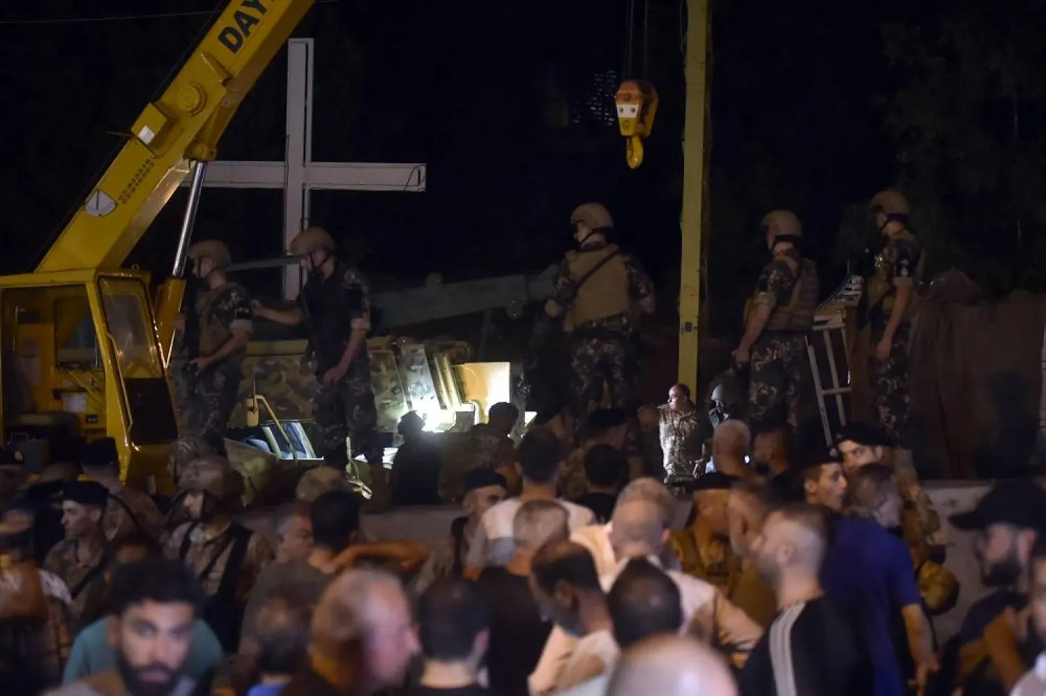 Lebanese soldiers gather near a Hezbollah military truck that is overturned in the town of Kahaleh, Lebanon, 09 August 2023. (EPA) 