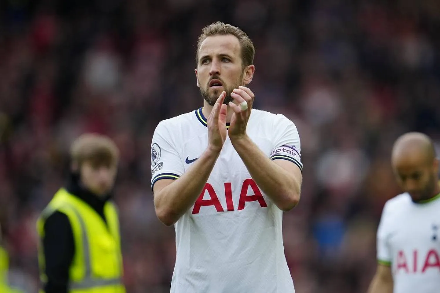 Tottenham's Harry Kane applauds fans after his team lost 4-3 at the end of an English Premier League soccer match between Liverpool and Tottenham Hotspur at Anfield stadium in Liverpool, Sunday, April 30, 2023. (AP)