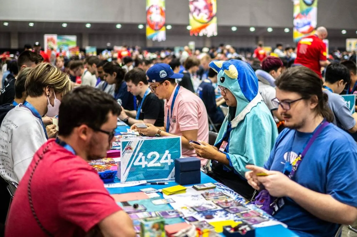  Competitors take part in the trading card game at the 2023 Pokemon World Championships in Yokohama on August 11, 2023. (AFP)