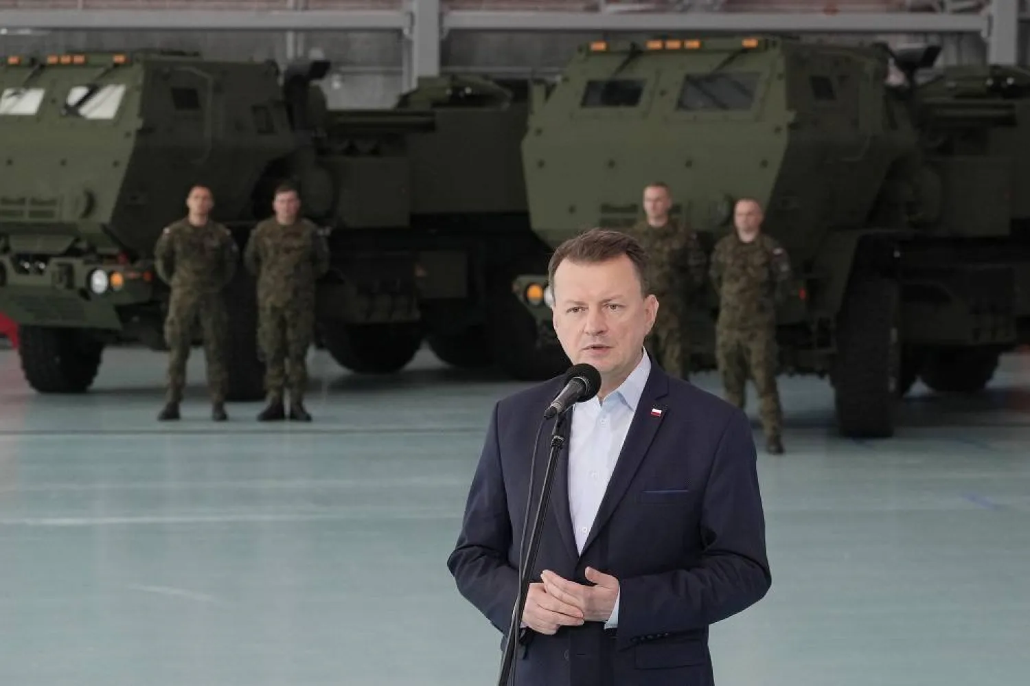 Poland's Defense Minister Mariusz Blaszczak speaks during ceremony after receiving its first shipment of US-made HIMARS rocket launchers, at an air base in Warsaw, Poland, on Monday, 15 May 2023. (AP) 