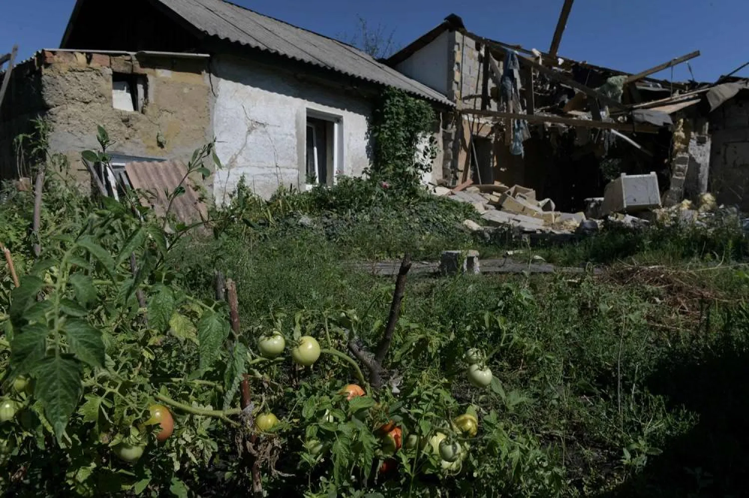  A house damaged during Ukrainian shelling of Russian controlled Donetsk, the capital of the self-proclaimed state of the Donetsk People's Republic (DPR) in eastern Ukraine on August 13, 2023. (AFP)