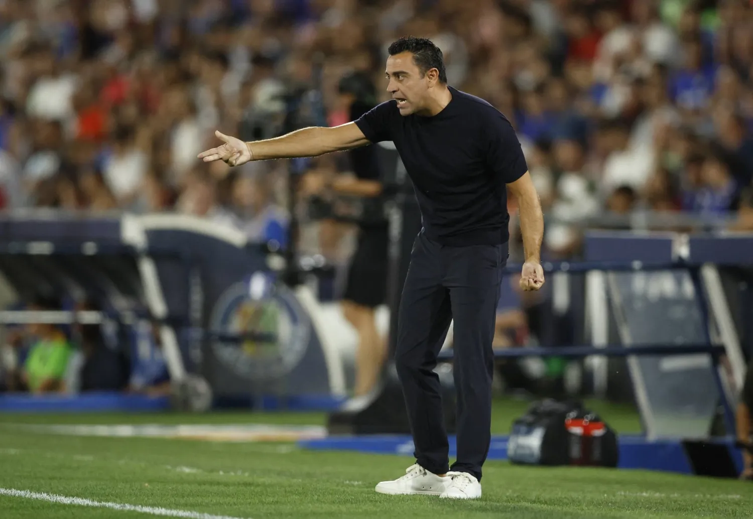 تشافي قال إنهم حاولوا بجدية وكانوا يستحقون الفوز (رويترز)