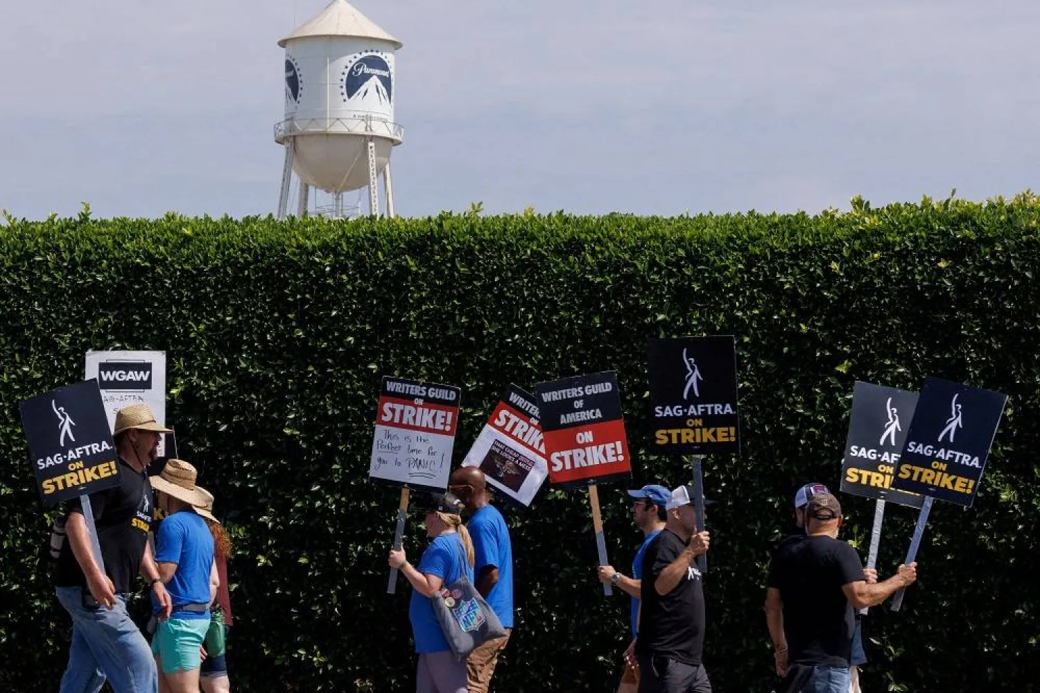SAG-AFTRA actors and Writers Guild of America (WGA) writers walk the picket line in front of Paramount Studios in Los Angeles, California, US, July 17, 2023. (Reuters)