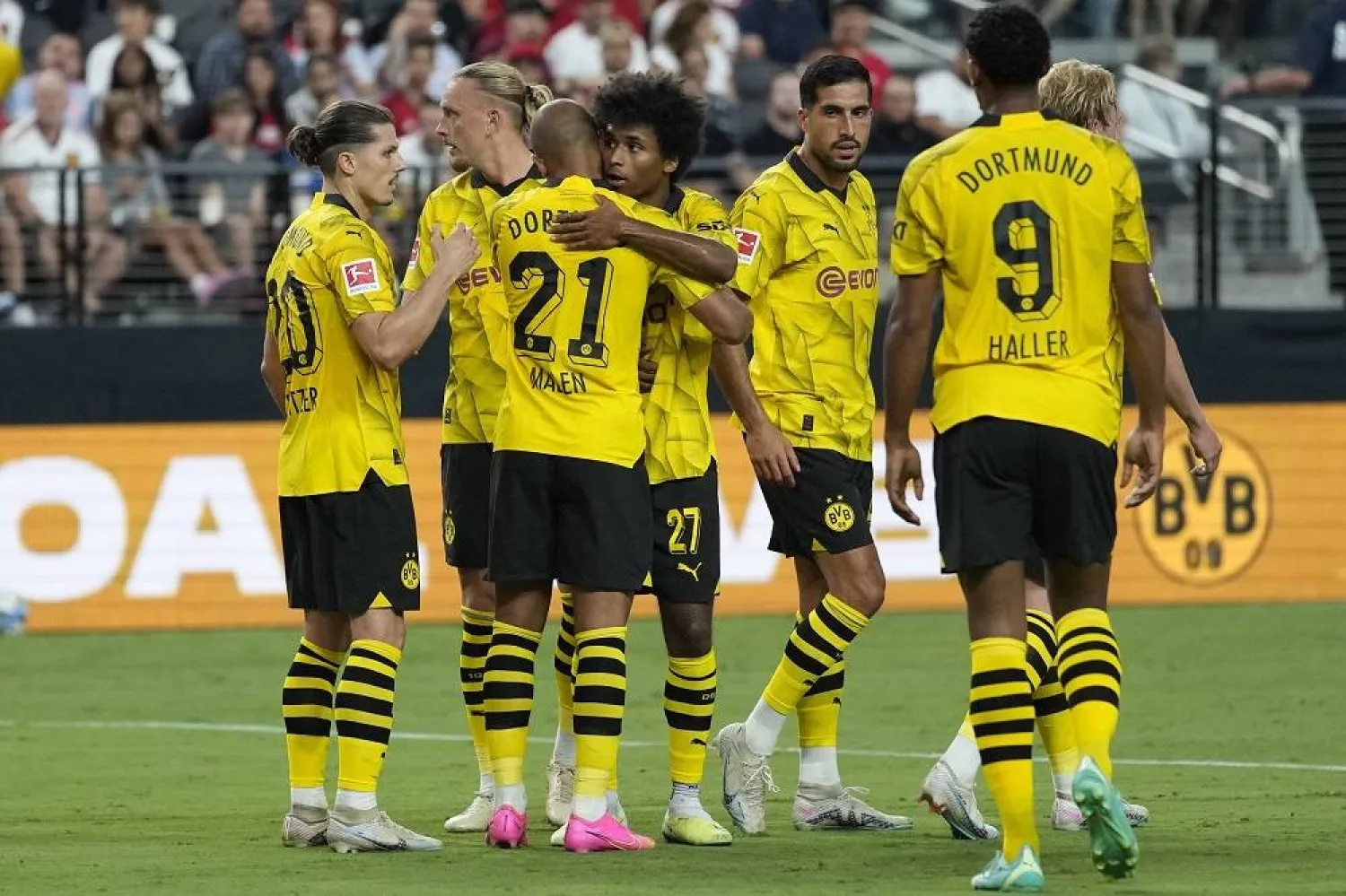Borussia Dortmund players celebrate after Donyell Malen (21) scored against Manchester United during the first half of an international friendly soccer match Sunday, July 30, 2023, in Las Vegas. (AP)