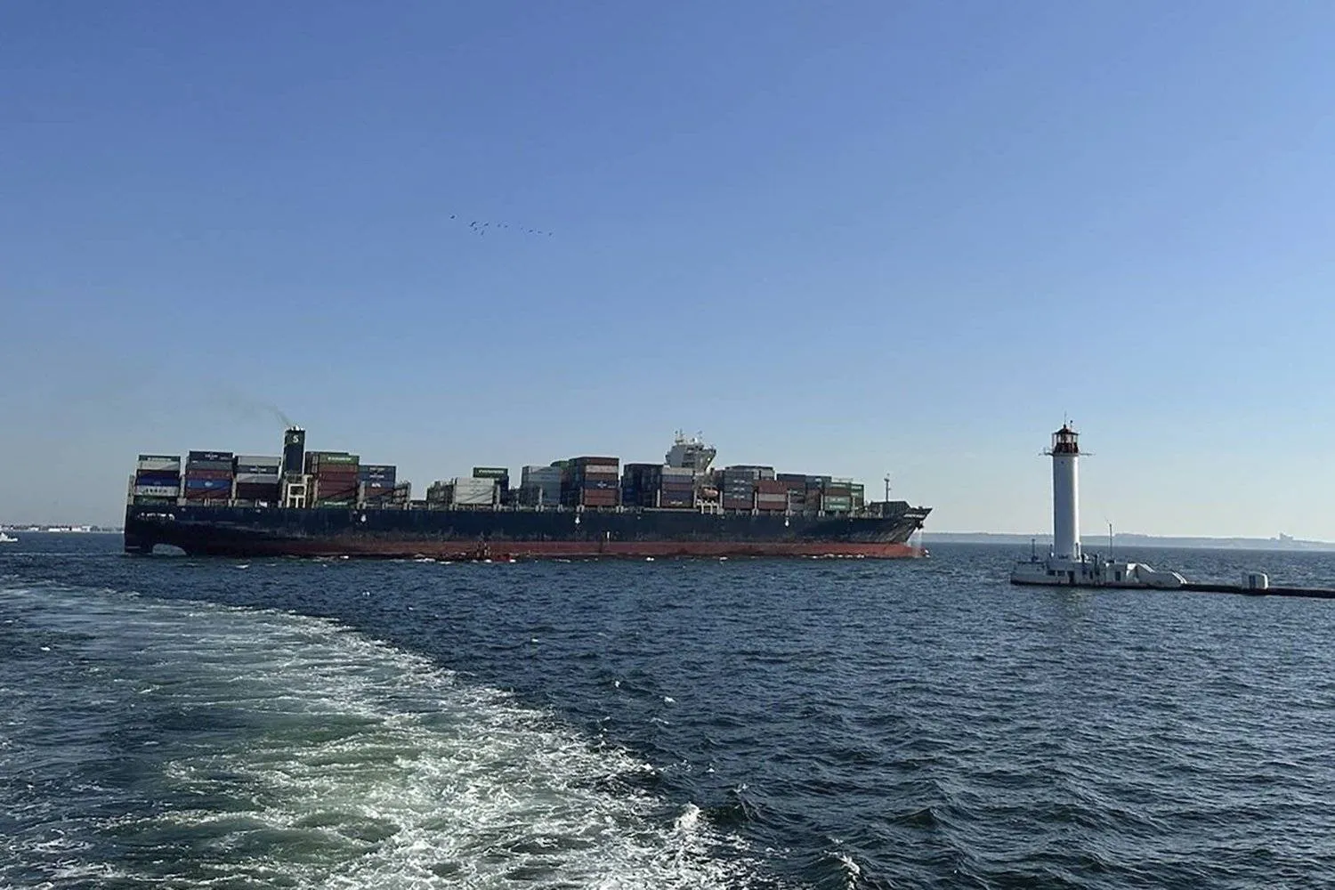 In this photo provided by Ukraine's Infrastructure Ministry Press Office, container ship Joseph Schulte (Hong Kong flag) leaves the port of Odesa to proceed through the temporary corridor established for merchant vessels from Ukraine's Black Sea ports in Odesa, Ukraine, Wednesday, Aug. 16, 2023. (Ukraine's Infrastructure Ministry Press Office via AP)