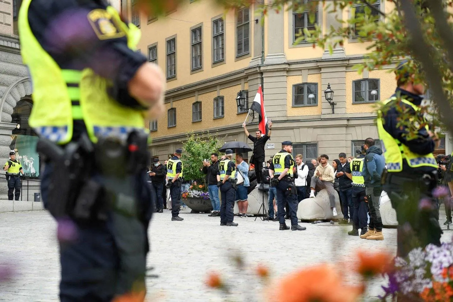 Police deployed during a protest to burn the Quran in Stockholm. (AFP) 