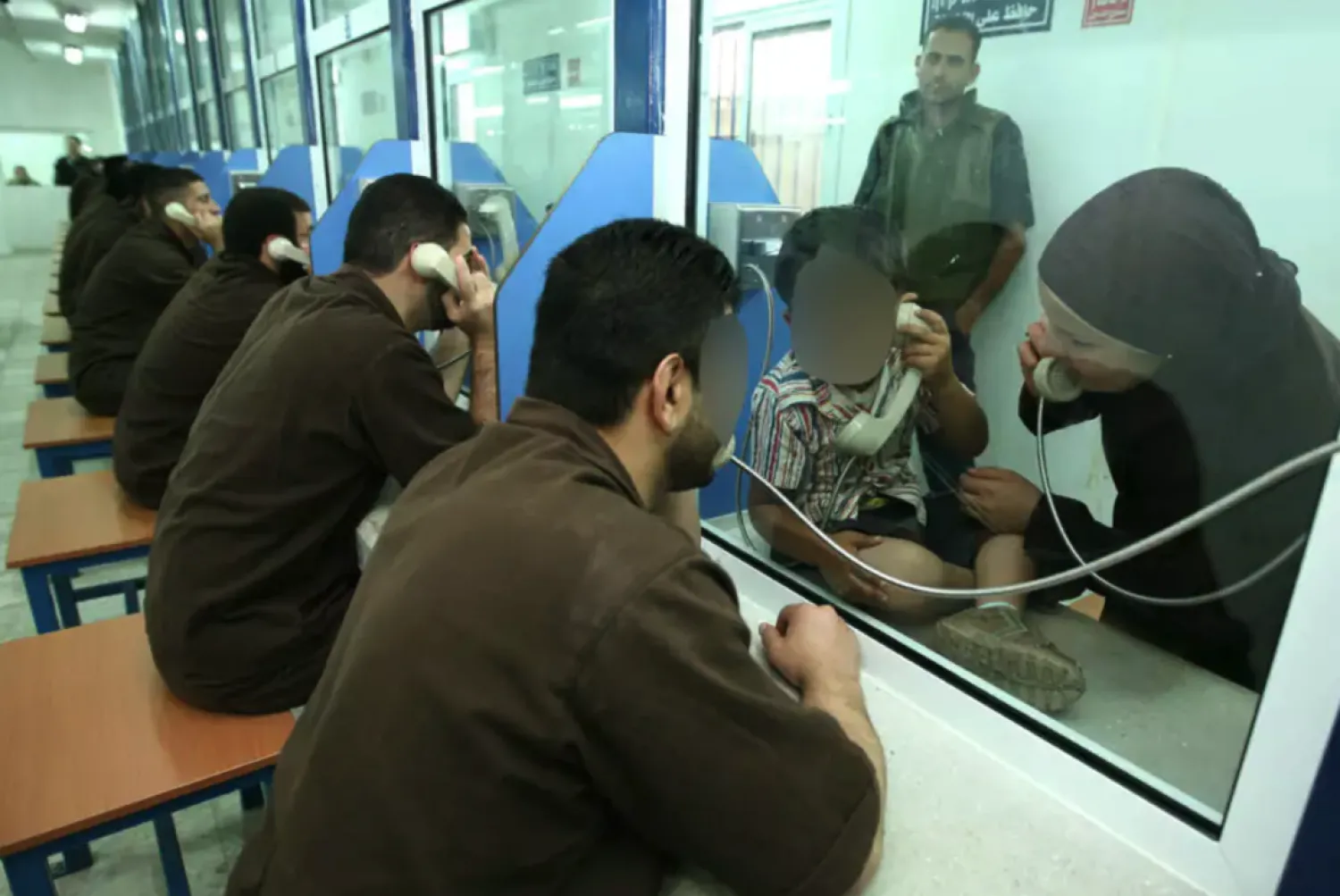 Palestinian prisoners during family visit (Prison Service)
